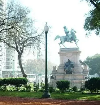 Monument to Giuseppe Garibaldi with a bronze equestrian statue on a stone pedestal in a park