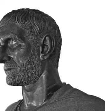 Capitoline Brutus bronze bust in left profile with wavy hair, beard, and an inlaid eye.