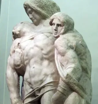Palestrina Pietà marble sculpture with three intertwined figures, showing rough unfinished surfaces and chisel marks.
