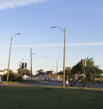 The Gen. Beauregard equestrian statue is partially visible at the far right, rising on a tall pedestal beside a green traffic circle.