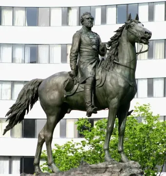 George Henry Thomas equestrian statue of a bearded military officer on horseback with a modern building behind it