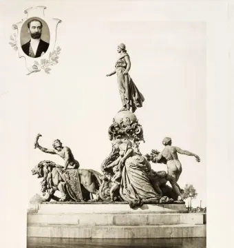 The Triumph of the Republic monument with a female figure atop a globe, allegorical figures below, and a framed portrait in the upper left.