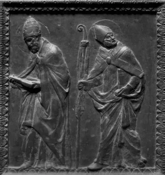 Relief panel from Donatello\'s Door of the Apostles showing two robed haloed figures, one holding a book and the other a staff.