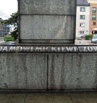 Granite pedestal of the Adam Mickiewicz monument with the inscription \