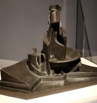 Development of a Bottle in Space, a dark bronze abstract sculpture with geometric and curving forms on a tiered base.