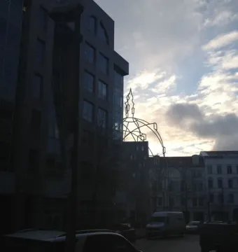 Memoria Urbana, a skeletal church outline silhouetted against a cloudy sky in Berlin.