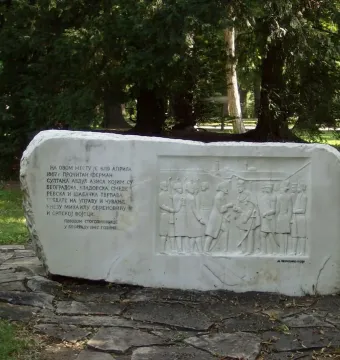 Keys Handover Memorial stone block with Cyrillic inscription and relief of figures exchanging keys