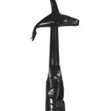 Spirit of Haida Gwaii sculpture with a stylized killer whale atop a carved column of abstract figures.
