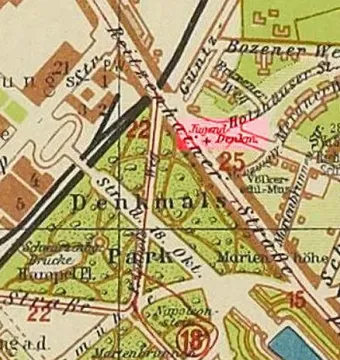 A section of an aged Leipzig map marking the Youth Monument with the German label \'Jugend Denkmal\' and a red cross in a park area.