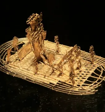 The Muisca Raft, a golden raft sculpture with a central figure wearing an elaborate headdress and several smaller figures around it.