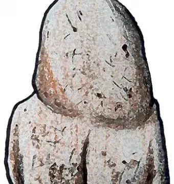 Venus of Tan-Tan, a light-colored pebble shaped like a stylized human figure seen from the back.