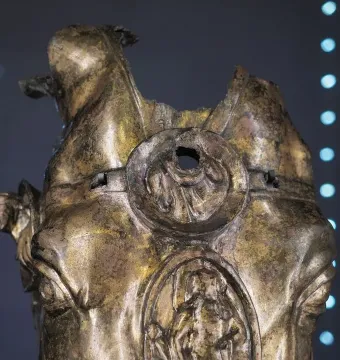 Fragmented gilded bronze horse head from Waldgirmes with weathered surface and relief details on the forehead