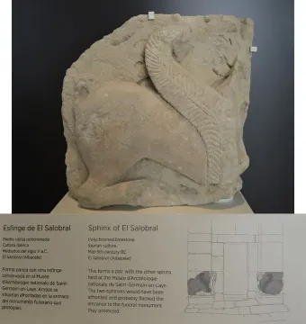 El Salobral sphinx sculpture displayed on a white pedestal with a museum information plaque below it.