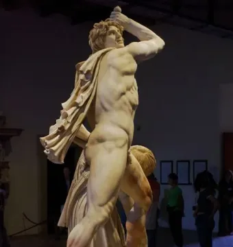 Ludovisi Gaul marble sculpture of a muscular figure holding a dagger aloft, with a fallen figure below.
