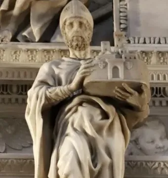 Saint Petronius stone statue in robes and a mitre, holding a miniature walled city.