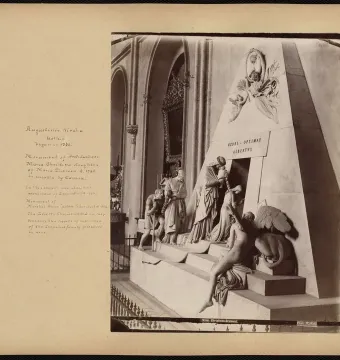 Cenotaph of Archduchess Maria Christina with a white pyramidal monument and sculpted mourners approaching a dark entrance.