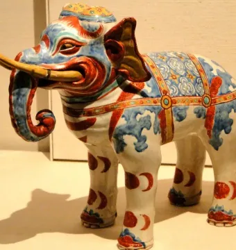 Kakiemon elephant porcelain figurine with blue and red floral patterns