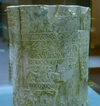 Carved ivory pyxis of the Situla of the Pania with friezes of figures, animals, and decorative motifs.