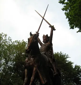 King Jagiello Monument, a bronze equestrian statue of a crowned figure holding two crossed swords aloft in Central Park.