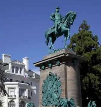 The equestrian bronze statue of Major General George B. McClellan on a tall stone pedestal, with military reliefs at the base.