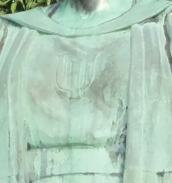 Close-up of Alma Mater showing the stylized U symbol on the statue’s chest.