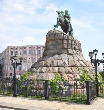 Monument to Bohdan Khmelnytsky, a bronze equestrian statue on a tiered stone pedestal with vines.