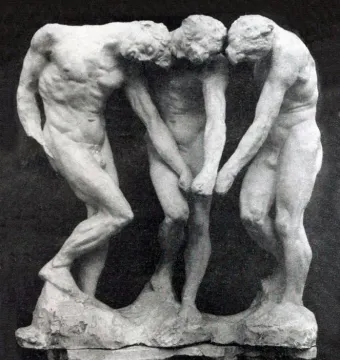 The Three Shades sculpture by Auguste Rodin, showing three nude male figures with bowed heads standing closely together.