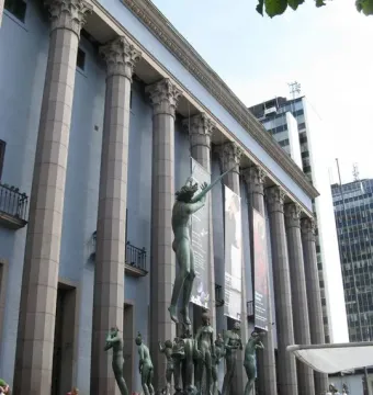 Orpheus Fountain in front of Stockholm Concert Hall, with a bronze figure playing an instrument and smaller statues around the basin.