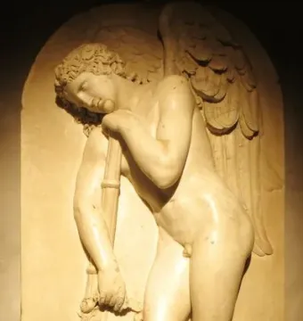 Marble bas-relief from the Monument to Elena Pavlovna showing a sorrowful winged figure leaning on an inverted torch.