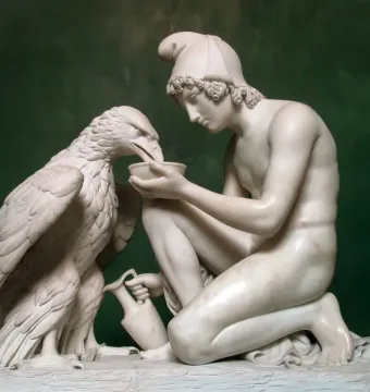 Ganymede with Jupiter\'s Eagle marble sculpture of a kneeling youth offering a bowl to an eagle