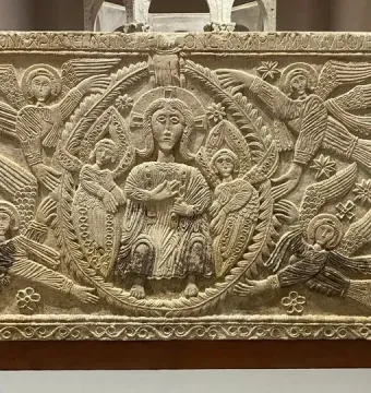 Rachis Altar relief with a robed haloed figure surrounded by winged haloed figures and an inscription along the top