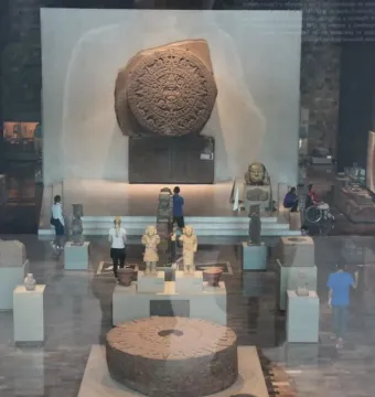 Stone of Motecuhzoma I circular carved monolith displayed in a museum hall