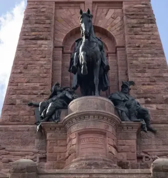 Kyffhäuser Monument with a large bronze equestrian statue in an arched alcove, flanked by seated bronze figures.