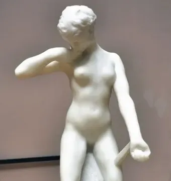 Standing Fauness, a white marble nude female sculpture with her head bowed, one hand at her neck and the other holding a downward-pointing club.
