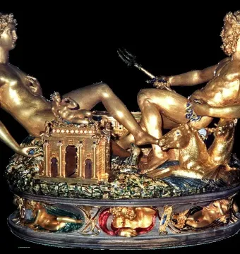 Cellini Salt Cellar with two reclining golden figures, a trident, and an ornate base
