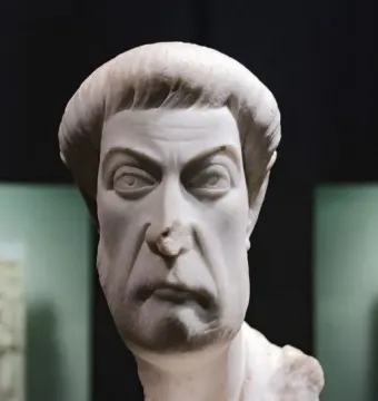 Marble bust of Eutropius with a stern expression, short cropped hair, and a textured beard and mustache.