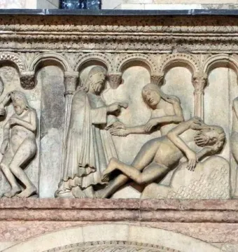 Stone relief from Scenes from Genesis showing several figures beneath small arches, including clothed people gesturing toward nude bodies and a tree at the right.
