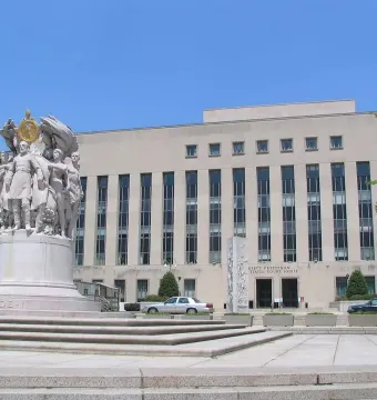 George Gordon Meade Memorial on a stone plaza in front of a courthouse building.