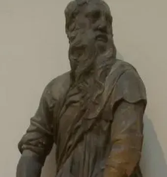 The Sacrifice of Isaac sculpture showing an older bearded man restraining a kneeling younger man with a blade.