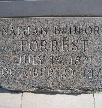 Close-up of the Nathan Bedford Forrest grave marker with carved name and dates.