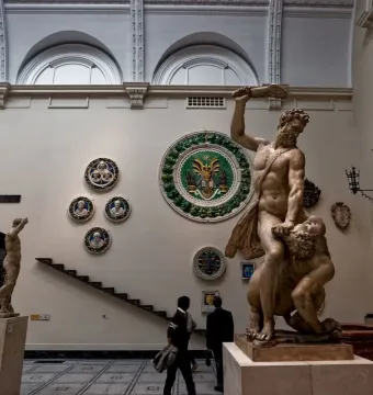 Samson Slaying a Philistine marble sculpture showing two muscular figures in a dramatic struggle, with one raising a weapon over the other.