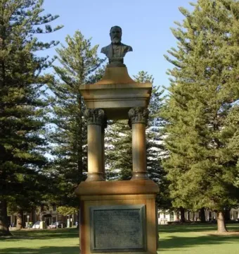 Maitland Brown Memorial stone monument with plaques, a canopy on columns, and a bronze bust on top.