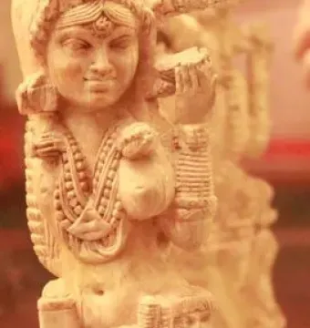 Ivory Pompeii Lakshmi figurine with a smaller attendant below her arm