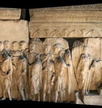 Plutei of Trajan marble relief with carved Roman figures and a seated central figure framed by classical architecture.
