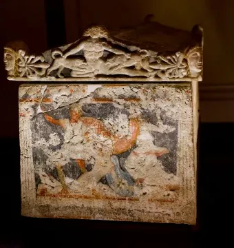 Amazon Sarcophagus with a sculpted lid and faded painted figures on the sarcophagus body