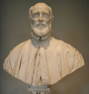 White marble bust of Francesco Barberini with a beard, mustache, and draped cape on a pedestal.
