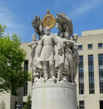 George Gordon Meade Memorial with a central military figure, allegorical statues, and a golden eagle medallion above the inscription MEADE.