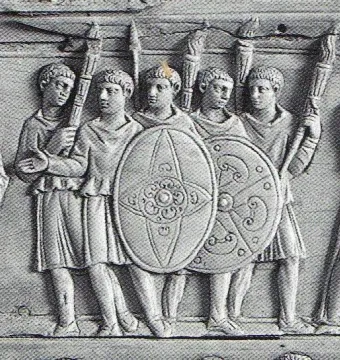 Detail of the Brescia Casket showing five ancient male figures in tunics holding shields and tall objects.