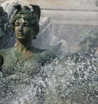 Bronze statue from the Monument aux Girondins, with a woman looking upward as water sprays around her.
