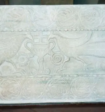 Plutei of Theodota stone relief with two stylized birds facing a chalice topped by a cross